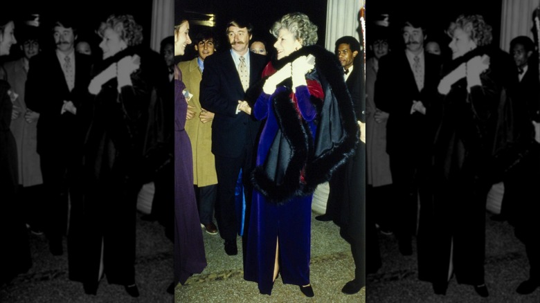 American philanthropist Jane Englehard wearing a blue velvet dress with a multicolored fur and velvet wrap at the Metropolitan Museum of Art Gala in New York City
