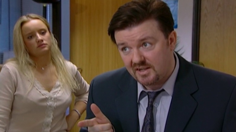 Ricky Gervais in and a co-star on Season 1 of "The Office"