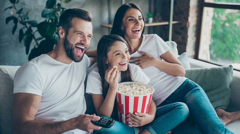 A family watching TV together