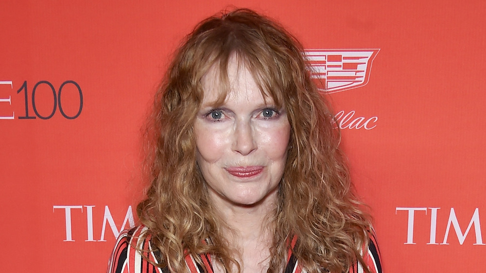 Mia Farrow smiles on the red carpet at an event