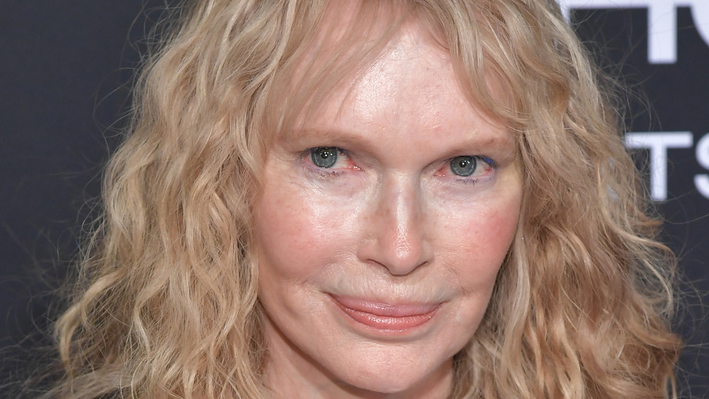 Mia Farrow grinning with hair down