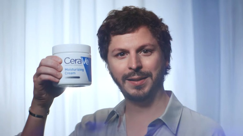 Michael Cera holding CeraVe cream