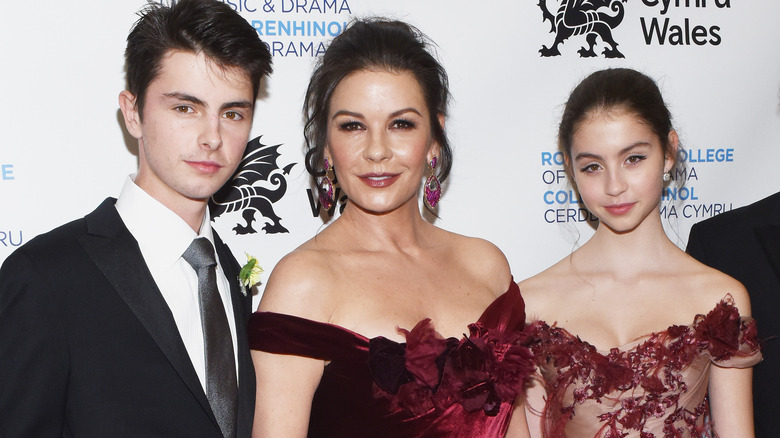 Dylan Michael Douglas, Catherine Zeta-Jones and Carys Zeta Douglas looking at camera