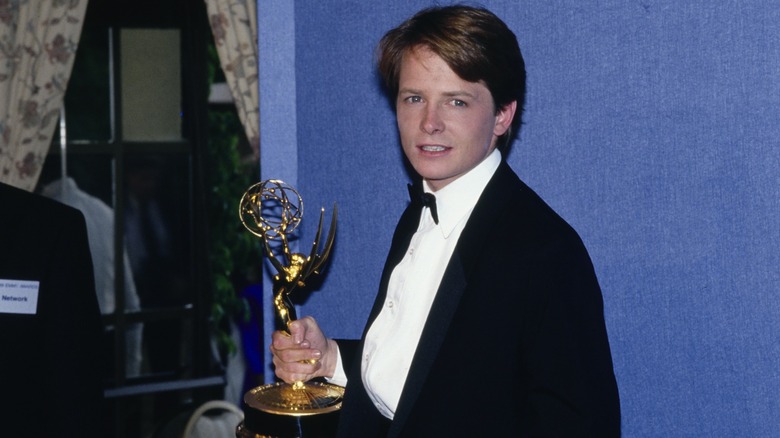 Michael J. Fox holding the first Emmy he won for "Family Ties" in 1986