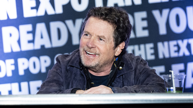 Michael J. Fox smiling while speaking at an event