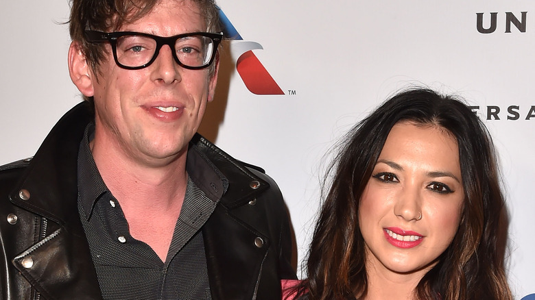 Michelle Branch and husband Patrick Carney stand together