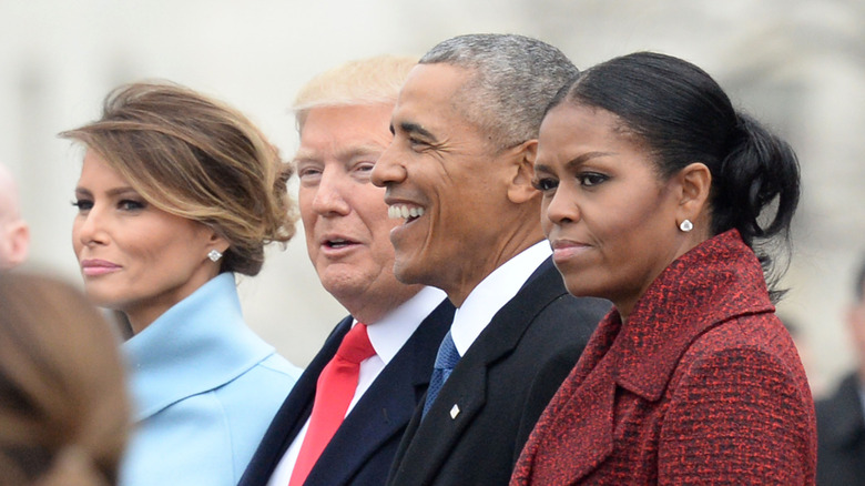 Melania and Donald Trump standing next to Barack and Michelle Obama