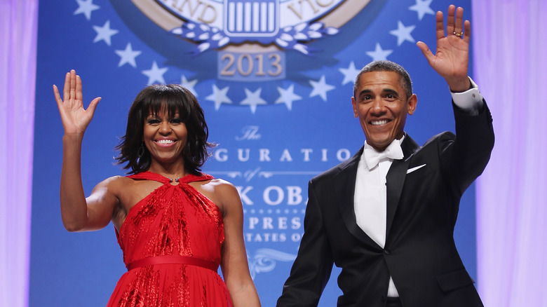 Barack Obama and Michelle Obama waving