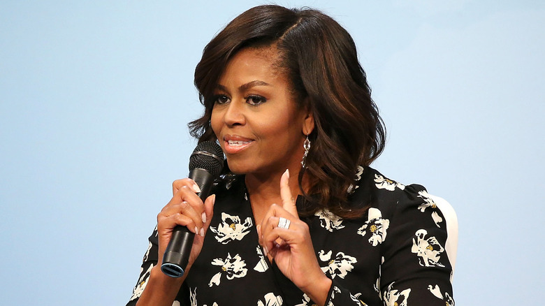 Michelle Obama talking and pointing with one finger