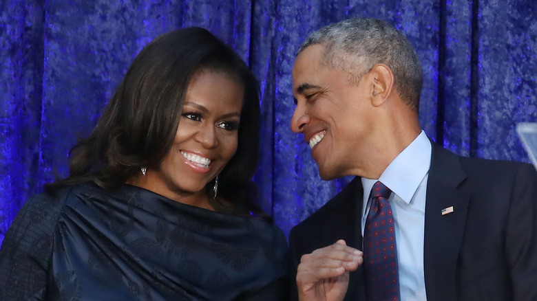 Michelle and Barack Obama smile together