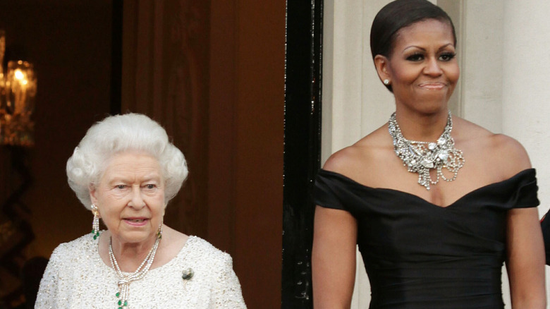 Barack and Michelle Obama and Queen Elizabeth posing together