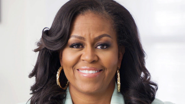 Michelle Obama smiling for photo