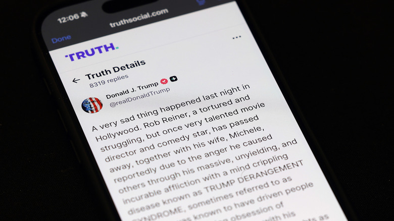 Photo of a phone showing Trump's Truth Social rant