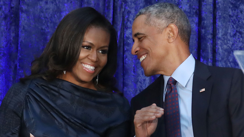 Michelle Obama and Barack Obama participate in the unveiling of their official portraits during a ceremony at the Smithsonian's National Portrait Gallery, on February 12, 2018 in Washington, DC.