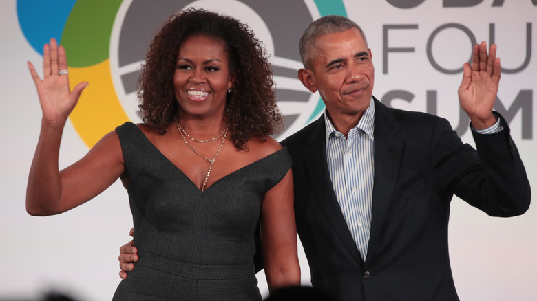 Michelle and Barack Obama waving