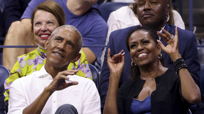 Barack and Michelle Obama watch the US Open
