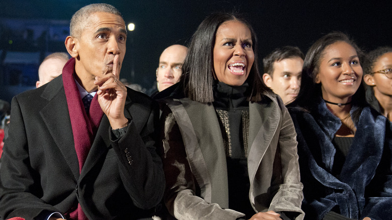 The Obama family watching an event
