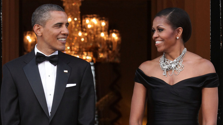 Barack and MIchelle Obama looking at each other and smiling