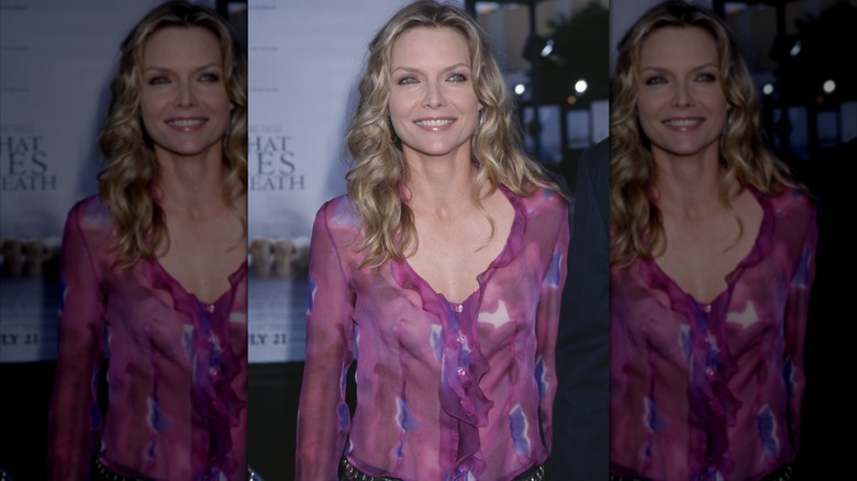 Michelle Pfeiffer in sheer ruffled V-neck blouse and loose curls