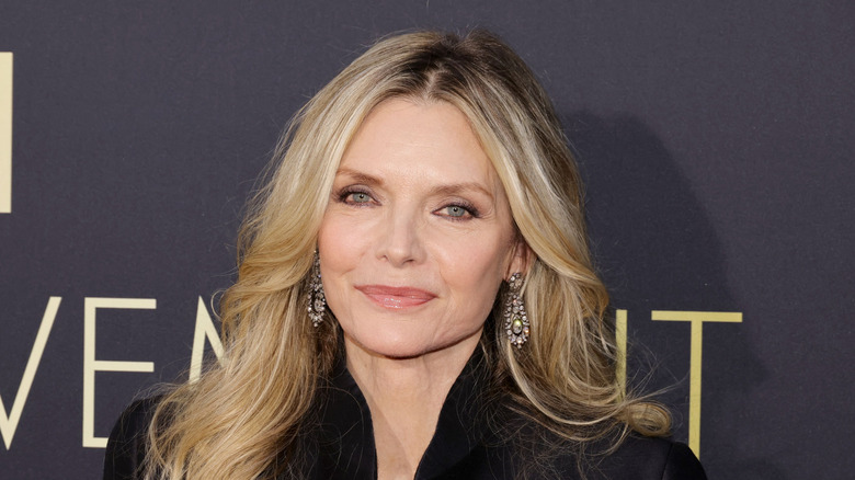 Michelle Pfeiffer in black with center part long blonde layers