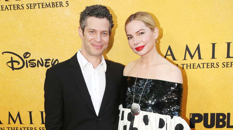 Michelle Williams and husband Thomas Kail posing
