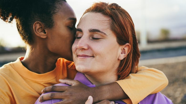 couple embracing outside