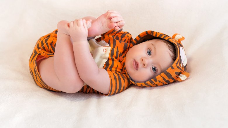 baby wearing tiger outfit