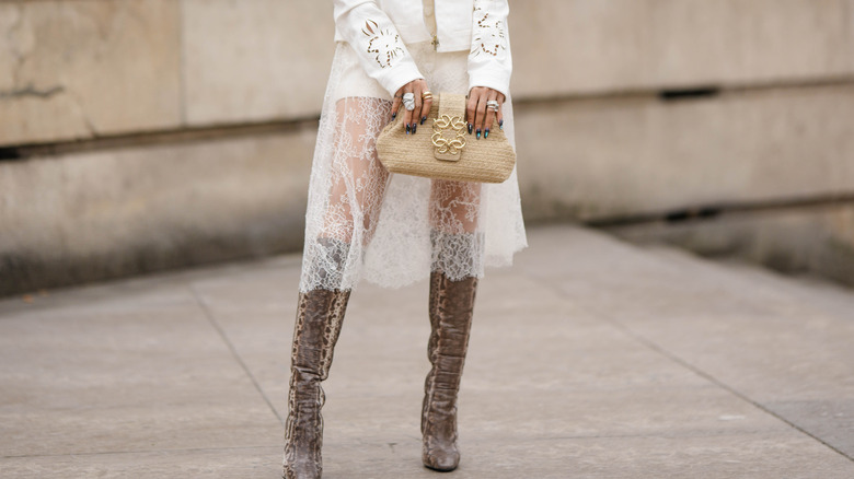 woman wearing lace midi skirt and boots