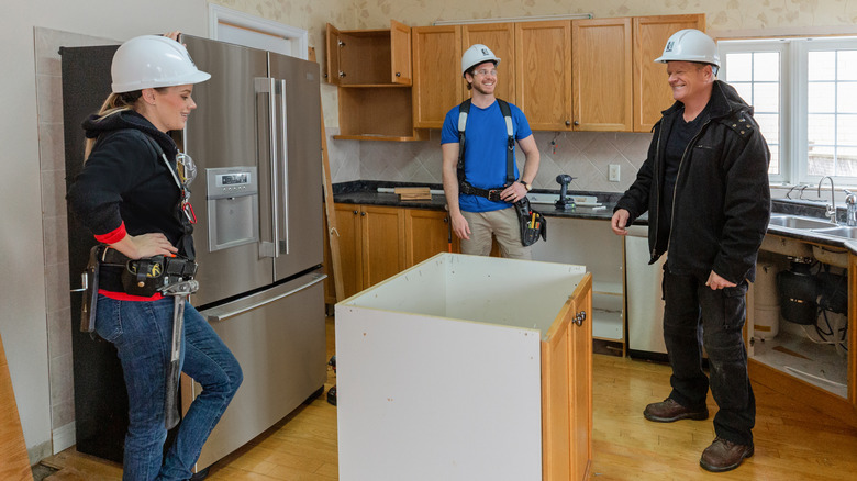Mike Holmes on project site with Sherry and Michael Holmes Jr.