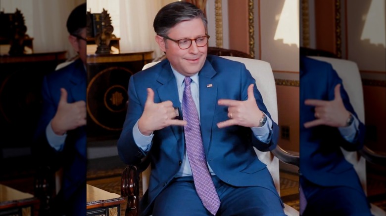 Mike Johnson making hand gestures on the Katie Miller podcast