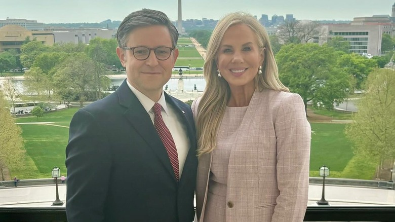 Mike Johnson on a balcony with Kelly Lary