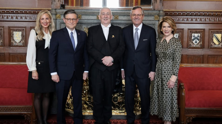 Kelly and Mike Johnson on the left of a group photo