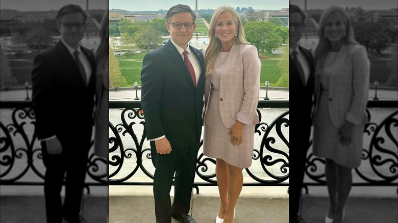 Mike Johnson standing next to his wife Kelly