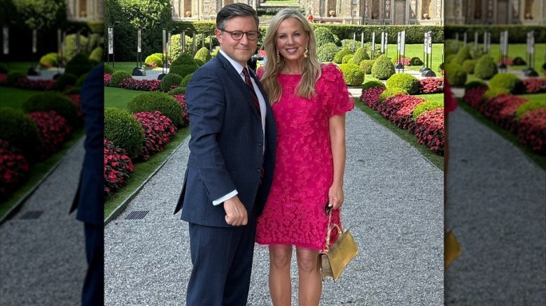 Mike Johnson and Kelly Johnson pose in front of a garden for Valentine's Day (2025)