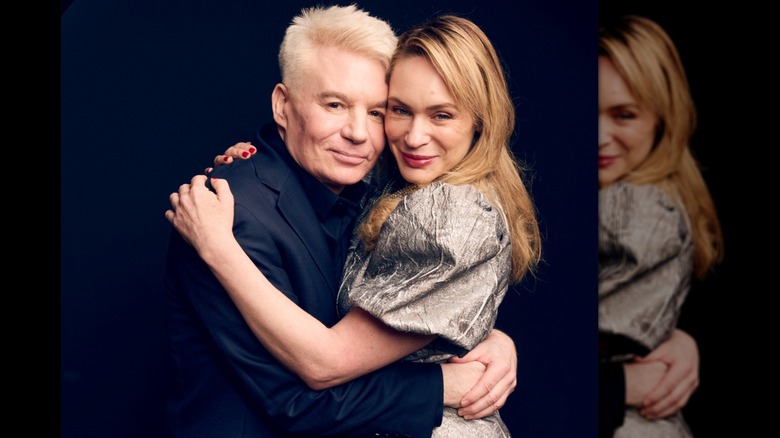 Mike Myers and Kelly Tisdale hugging and looking at the camera