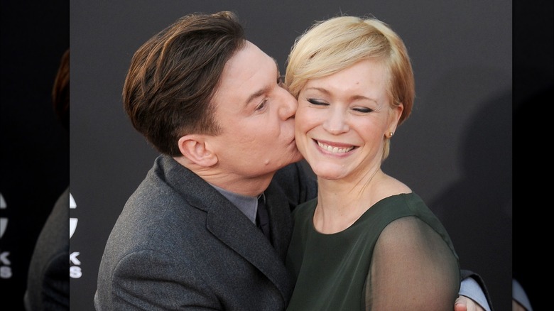 Kelly Tisdale closing her eyes as Mike Myers kisses her