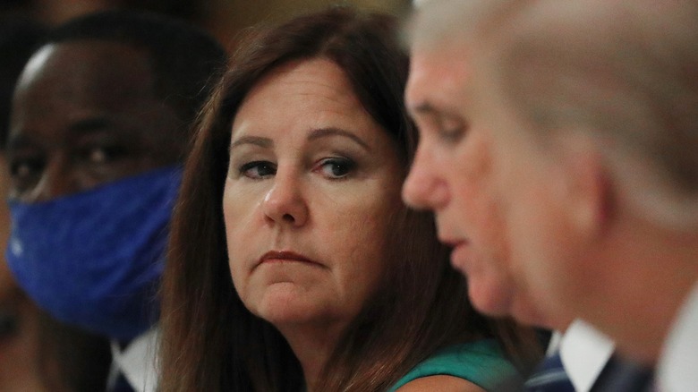 Karen Pence looking down the table at Mike Pence and Donald Trump
