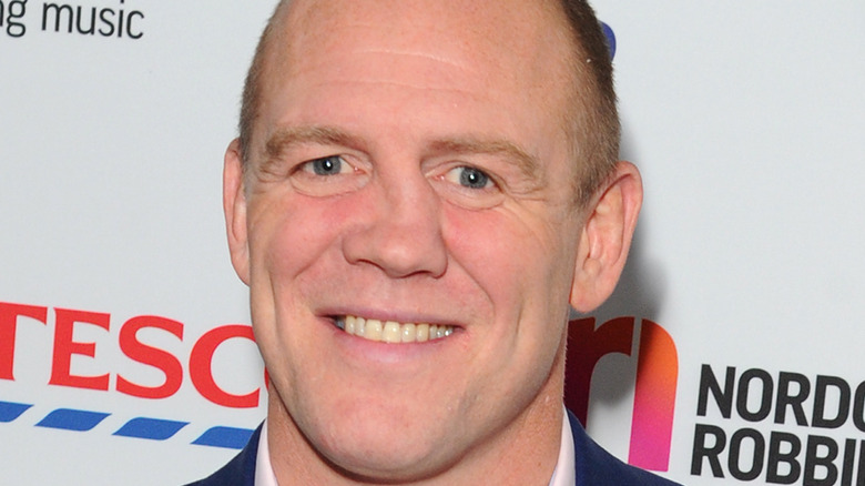 Mike Tindall smiling on the red carpet