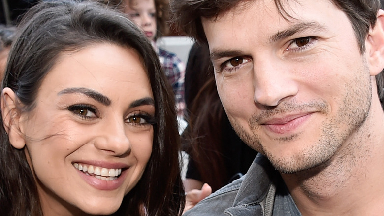 Mila Kunis and Ashton Kutcher smiling together