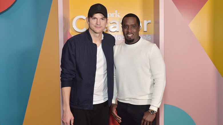Ashton Kutcher and Diddy smiling