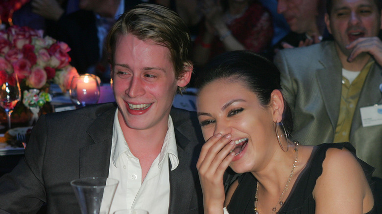 Macaulay Culkin and Mila Kunis sharing a laugh