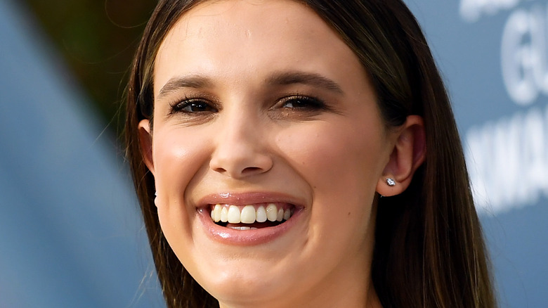 Millie Bobby Brown laughs on the red carpet