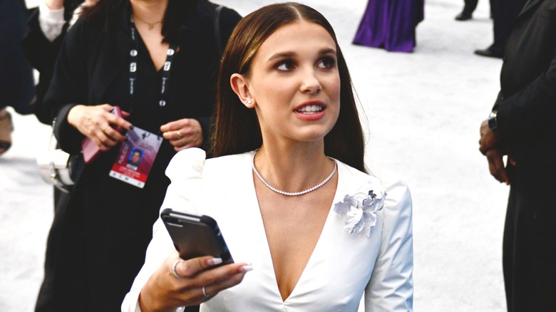 Millie Bobby Brown holding her phone at 2020 SAG Awards