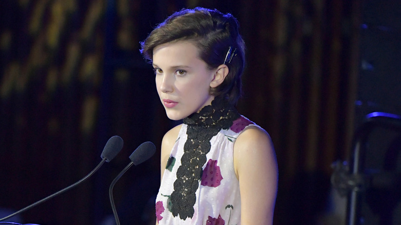 Millie Bobby Brown speaking on stage at Unicef event