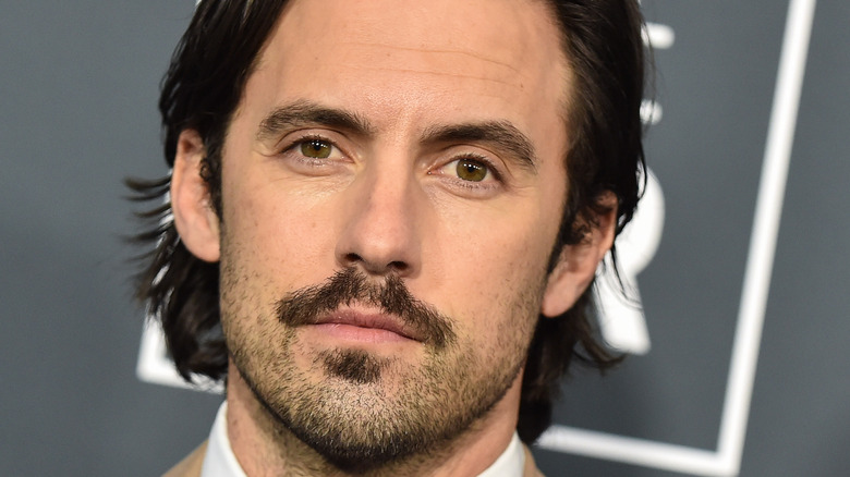 Milo Ventimiglia looking serious with facial hair