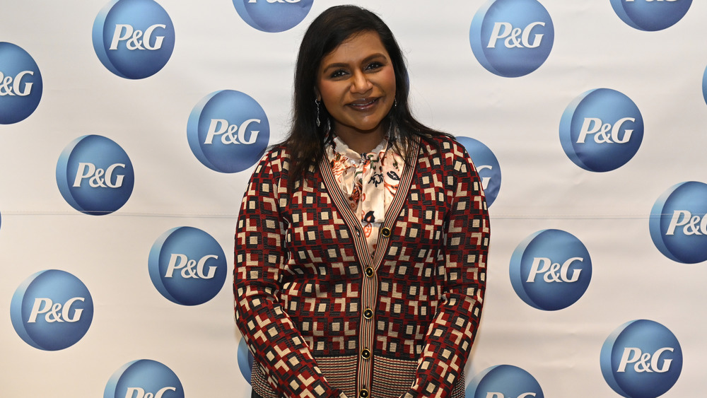 Mindy Kaling smiling in cardigan