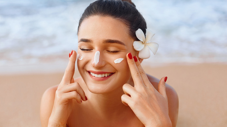 Applying sunscreen at the beach