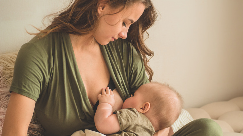 A woman breastfeeding her baby 