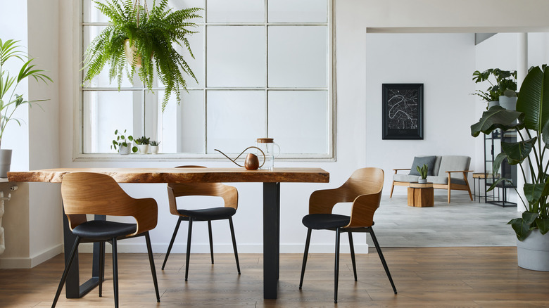 A minimalist house with a wooden dining table and chairs