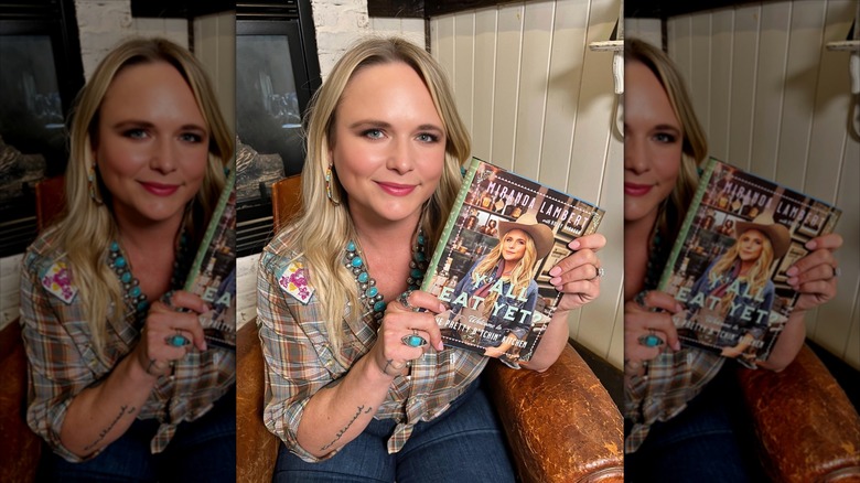 Miranda Lambert holding her cookbook
